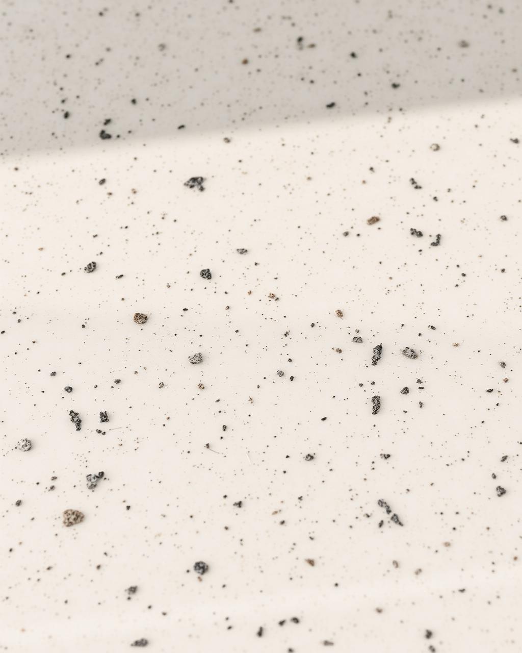Engineered quartz surface in a consistent tone